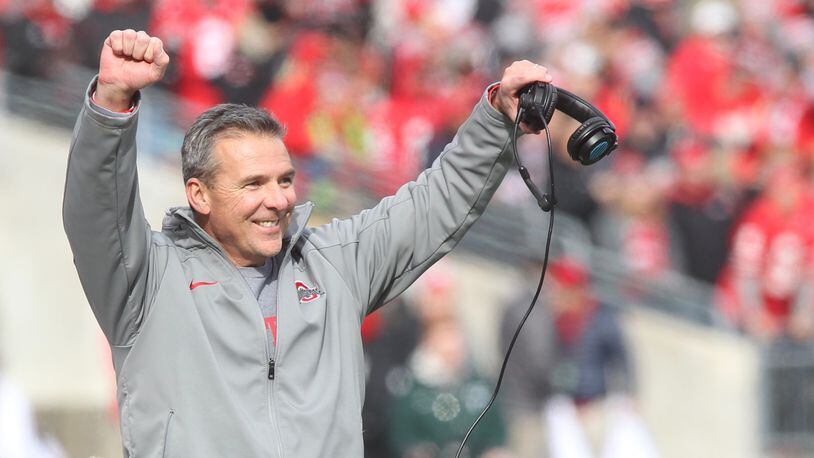 Ohio State's Urban Meyer smiles after a tackle by Ohio State's special teams against Michigan State on Saturday, Nov. 11, 2017, at Ohio Stadium in Columbus.