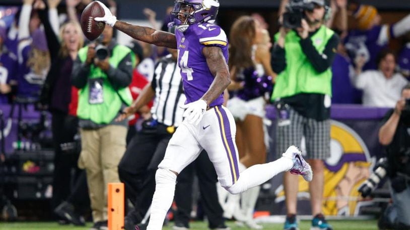 MINNEAPOLIS, MN - JANUARY 14:  Stefon Diggs #14 of the Minnesota Vikings scores a touchdown as time expires against the New Orleans Saints during the second half of the NFC Divisional Playoff game at U.S. Bank Stadium on January 14, 2018 in Minneapolis, Minnesota.  (Photo by Jamie Squire/Getty Images)