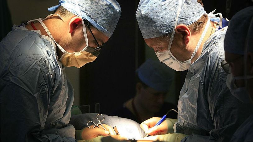 Doctors perform a kidney transplant at the Queen Elizabeth Hospital Birmingham in Birmingham, England, in a 2006 file photo.