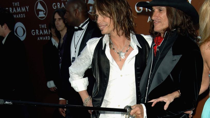 Musicians Steven Tyler (L) and Joe Perry of Aerosmith arrive at the 48th Annual Grammy Awards at the Staples Center on February 8, 2006 in Los Angeles, California. (Photo by Stephen Shugerman/Getty Images)