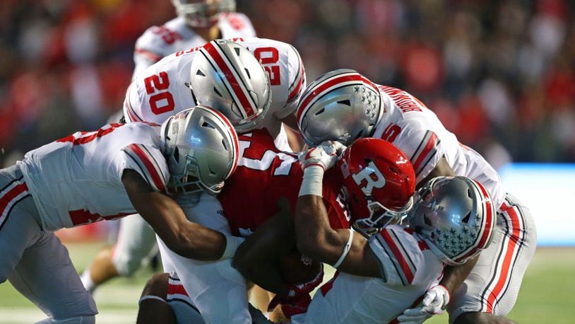 PISCATAWAY, NJ - SEPTEMBER 30: Running back Raheem Blackshear #25 of the Rutgers Scarlet Knights is gang tackled during a game against the Ohio State Buckeyes on September 30, 2017 at High Point Solutions Stadium in Piscataway, New Jersey. (Photo by Hunter Martin/Getty Images)