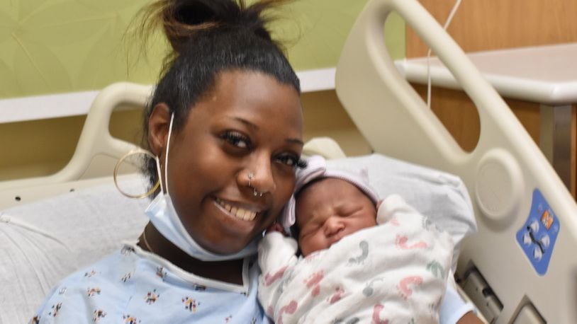 Jasmine Robinson, of Dayton, with newborn baby Rankin, who was born at 3:59 a.m. on New Year's Day in 2023 at Miami Valley Hospital in Dayton. SAMANTHA WILDOW\STAFF