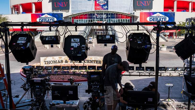 Television crews set up outside of the presidential debate site Monday Oct. 17, 2016 at the University of Nevada, Las Vegas in Las Vegas as preparation continue for the final debate between Democratic presidential nominee Hillary Clinton and Republican presidential nominee Donald Trump. (AP Photo/J. David Ake)