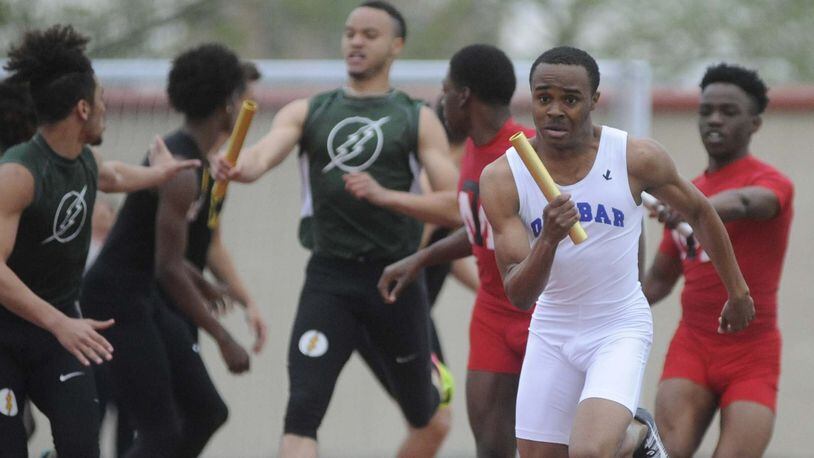 Dunbar’s Marquis Evans (right, front) takes the lead in the boys Swedish medley relay during the 67th Dayton Edwin C. Moses Relays at Welcome Stadium on Friday, April 21, 2017. MARC PENDLETON / STAFF