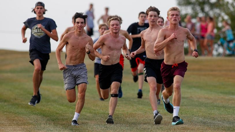 Cutline: The Cedarville High School cross country team runs during a recent practice at the Elvin R. King Cross Country Course in Cedarville. The Indians are ranked No. 1 in the Division III state poll. CONTRIBUTED PHOTO BY MICHAEL COOPER