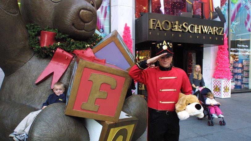 Nicholas Mann, 4, visiting New York with his family from Ohio plays on the FAO Schwarz teddy bear on Fifth Avenue in 2001. (Fred R. Conrad/The New York Times)