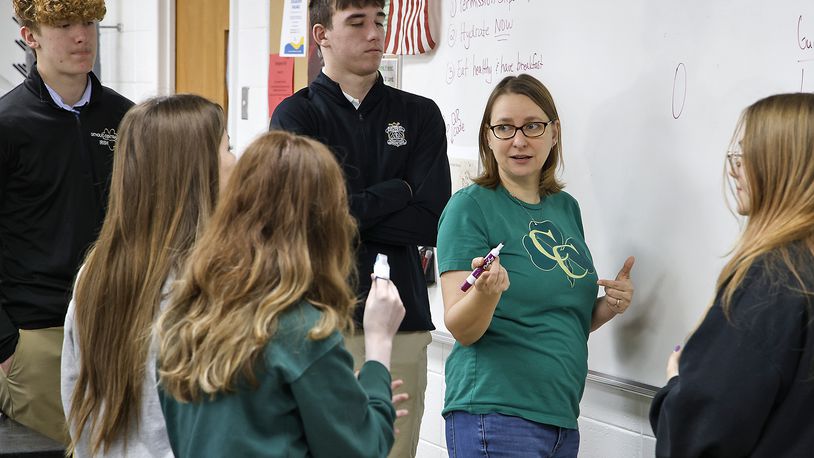 Kelly Brown teaches a chemistry class at Catholic Central High School Tuesday, March 5, 2024. BILL LACKEY/STAFF