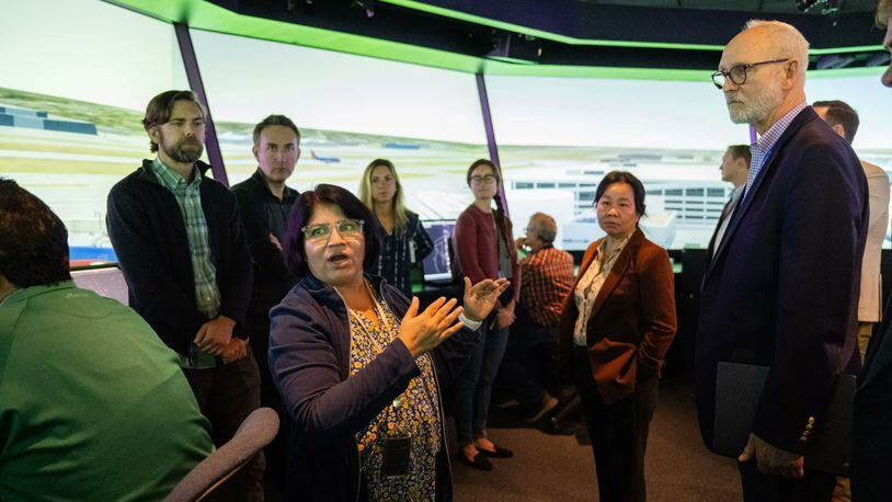Savvy Verma, left, and Huy Tran, director of aeronautics at NASA’s Ames Research Center in California’s Silicon Valley, center, explain a recent air traffic management simulation to guests at Ames’ FutureFlight Central simulator on Sept. 26.
Credit: NASA/Jesse Carpenter