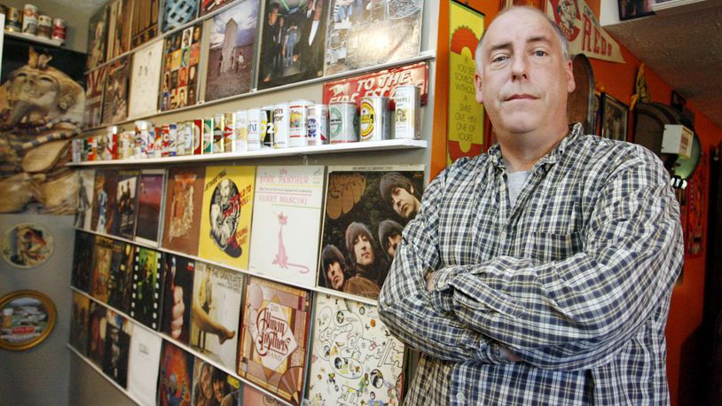 Jeff Miller of Springfield poses in the basement of his home which is decorated with record albums. Miller recalls the events of Dec. 3, 1979, when eleven people were trampled to death at a The Who concert in Cincinnati, a concert which he attended.