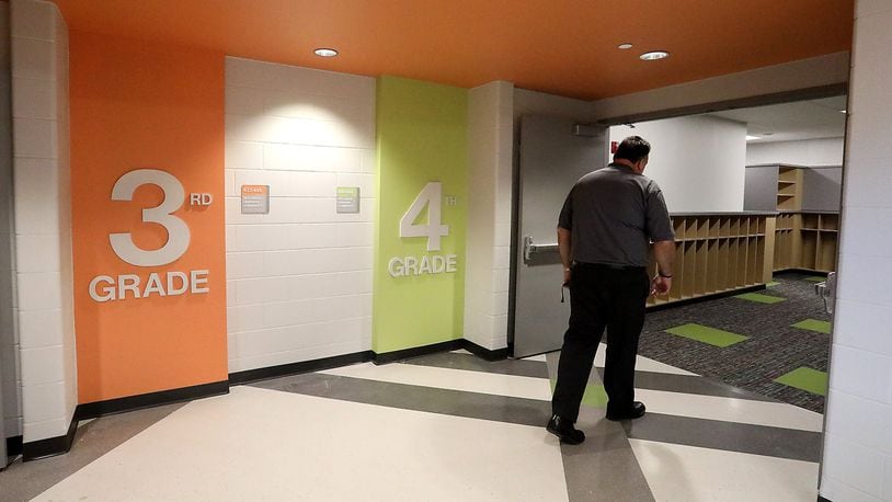 Urbana City Schools Superintendent Charles Thiel says the district is working on their finalized plan for the fall reopening. This is him walking into the 4th Grade Unit at the new Urbana Elementary and Junior High School a little over a year ago. BILL LACKEY/STAFF