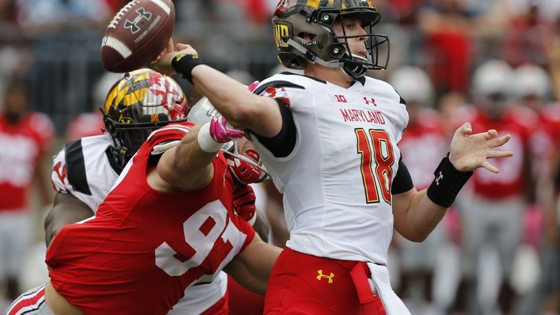 Ohio State defensive end Nick Bosa, left, causes Maryland quarterback Max Bortenschlager to fumble the ball during the first half in Columbus, Ohio. (AP Photo/Jay LaPrete, File)