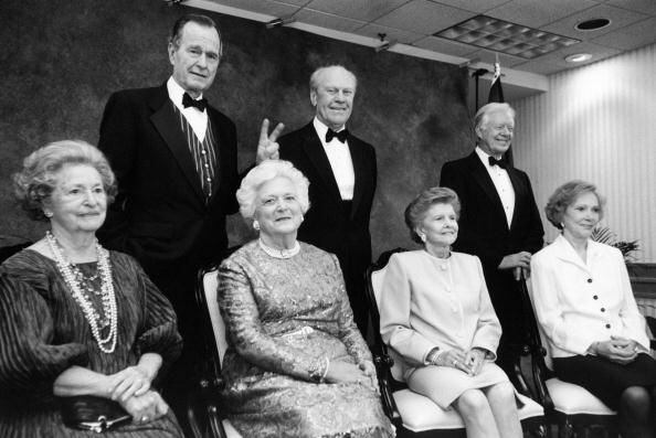 1977: Lady Bird Johnson, President George H.W. Bush, Barbara Bush, President Gerald R. Ford, Betty Ford, President Jimmy Carter, and Rosalyn Carter pose for a formal group portrait