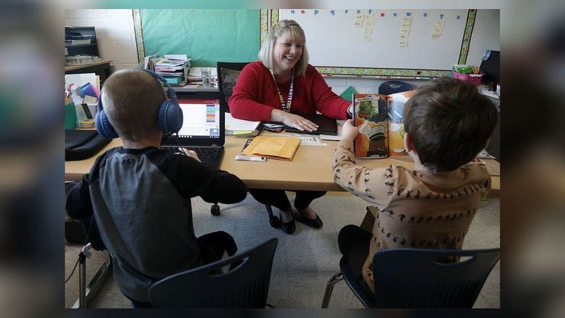 Ashley DuGan works with students in the Learning Recovery program at Northwestern Elementary School. BILL LACKEY/STAFF