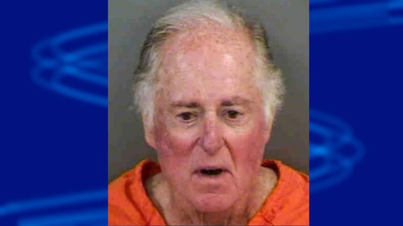 Sportscaster Warner Wolf was arrested for allegedly defacing a community sign he considered racist.