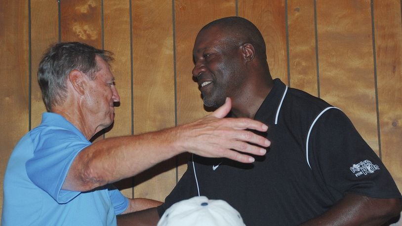 Pro Football Hall of Famer Dick LeBeau, left, greets former Cincinnati Bengal David Fulcher during the 2015 Dick LeBeau Legends Golf Classic at Mitchell Hills Club. LeBeau will return along with several other retired professional athletes for a tournament and special dinner fundraiser on July 15 at Mitchell Hills. The public can purchase tickets for the dinner for $20. CONTRIBUTED