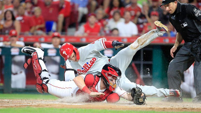 CINCINNATI, OH - JULY 26: Tucker Barnhart #16 of the Cincinnati Reds tags out Scott Kingery #4 of the Philadelphia Phillies at home plate in the fifth inning at Great American Ball Park on July 26, 2018 in Cincinnati, Ohio. (Photo by Andy Lyons/Getty Images)