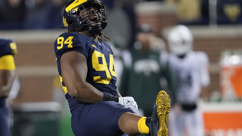 Michigan defensive lineman Kris Jenkins (94) reacts to a tackle against Michigan State in the second half of an NCAA college football game in Ann Arbor, Mich., Saturday, Oct. 29, 2022. (AP Photo/Paul Sancya)