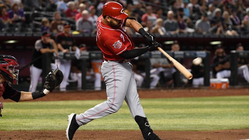 PHOENIX, ARIZONA - SEPTEMBER 15: Eugenio Suarez #7 of the Cincinnati Reds hits a solo home run off of Zac Gallen #59 of the Arizona Diamondbacks during the sixth inning at Chase Field on September 15, 2019 in Phoenix, Arizona. It was the second home run of the game for Suarez. (Photo by Norm Hall/Getty Images)