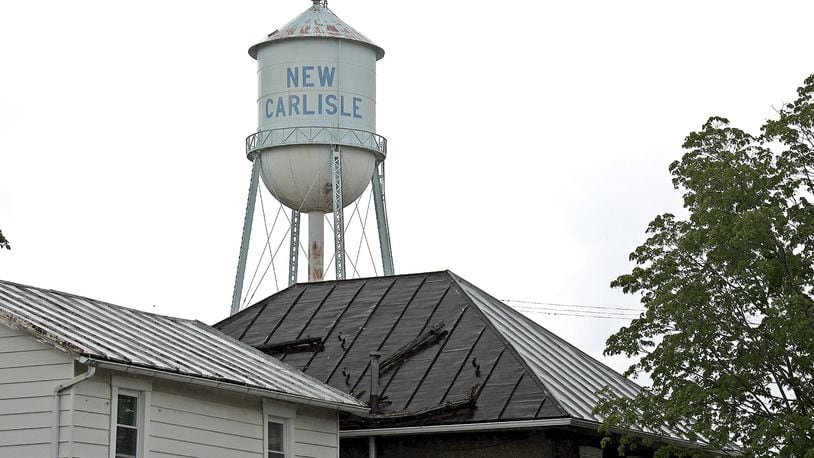 The Adams Water Tower, for decades a fixture in the sky over New Carlisle, will be demolished starting Monday. BILL LACKEY/STAFF
