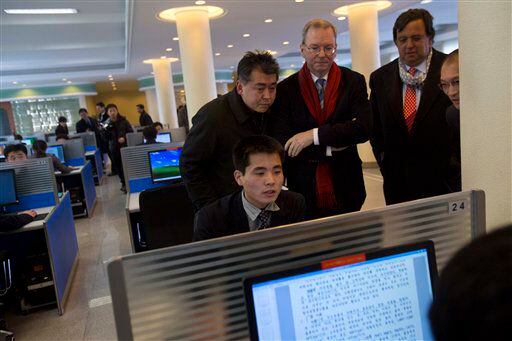 Executive Chairman of Google, Eric Schmidt, third from left, and former New Mexico governor Bill Richardson, second from right, watch as a North Korean student surfs the Internet.