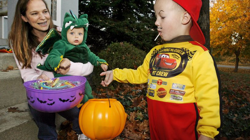 Springfield residents trick-or-treating on Pythian Avenue during Beggar’s Night. Staff Photo
