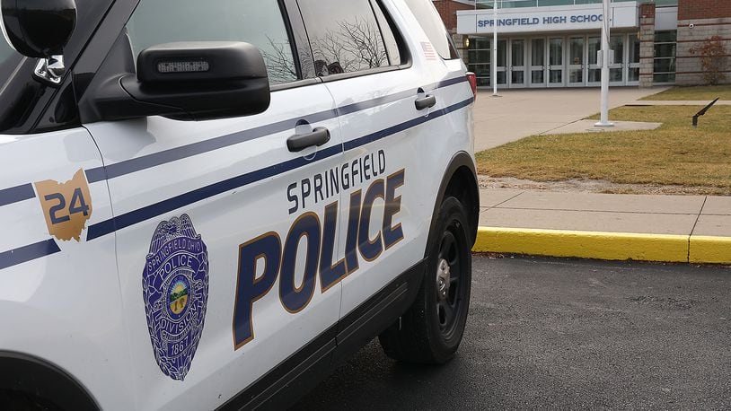 A Springfield Police patrol car, used by the school resource officer, sits in front of Springfield High School Friday. BILL LACKEY/STAFF