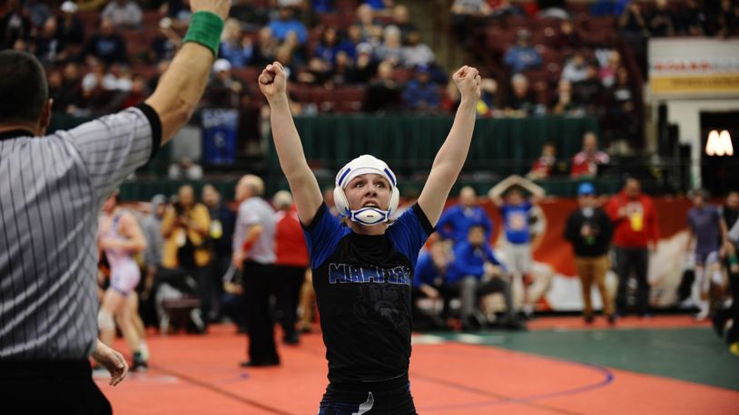 Miami East’s Olivia Shore has her hand raised after winning her opening-round bout at the state wrestling tournament Thursday at the Schottenstein Center in Columbus. Greg Billing/CONTRIBUTED