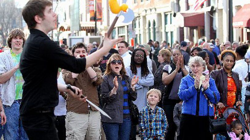 People watch a street performer during the NCAA First Four Festival in downtown Dayton’s Oregon District Sunday, March 11, 2012. (Contributed photo from E.L. Hubbard)