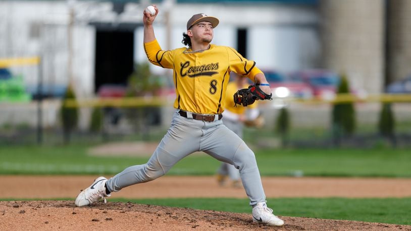 Cutline: Kenton Ridge High School junior pitcher Jake Beard throws a pitch during their game at Shawnee earlier this season. Michael Cooper/CONTRIBUTED