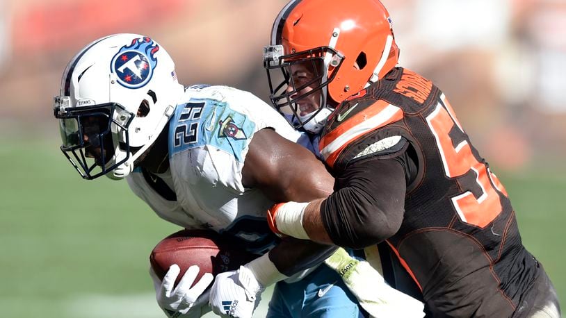 Cleveland Browns outside linebacker Joe Schobert (53) tackles Tennessee Titans running back DeMarco Murray (29) in the second half of an NFL football game, Sunday, Oct. 22, 2017, in Cleveland. (AP Photo/David Richard)