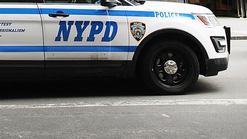 Video from a local news station shows a man in handcuffs jump out of an open window of an NYPD police car, similar to the one pictured.