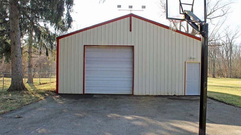 A 30-by-30-foot pole barn is located in the backyard.