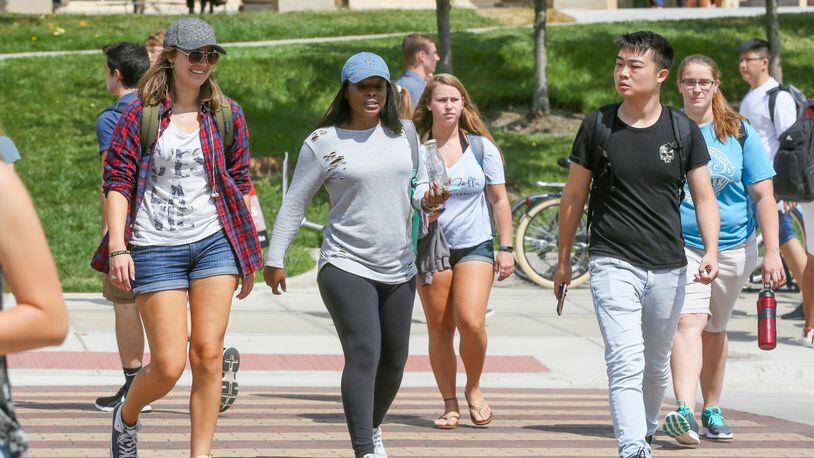 Students walk to classes on the Miami University campus in Oxford.