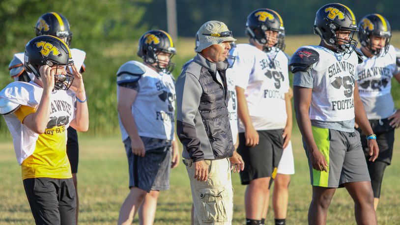Shawnee High School football coach Rick Meeks leads the team during defensive drills during a preseason practice on Saturday, Aug. 3, 2019. CONTRIBUTED PHOTO BY MICHAEL COOPER