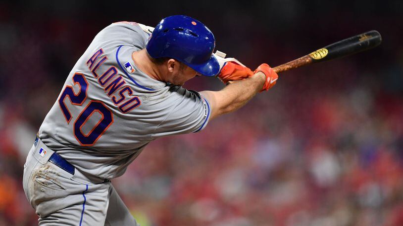 CINCINNATI, OH - SEPTEMBER 20: Pete Alonso #20 of the New York Mets hits his 50th home run of the season, a two-run shot in the eighth inning against the Cincinnati Reds at Great American Ball Park on September 20, 2019 in Cincinnati, Ohio. New York defeated Cincinnati 8-1. (Photo by Jamie Sabau/Getty Images)