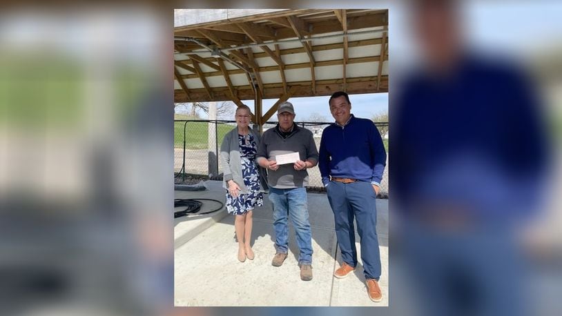 Eddie Bell and Mary Jo Leventhal, of Springfield Rotary, presented a $25,000 check to Terry Fredrich, of Jefferson Street Oasis, in honor of the upcoming 10th anniversary of the Springfield Rotary Gourmet Food Truck Competition. Contributed