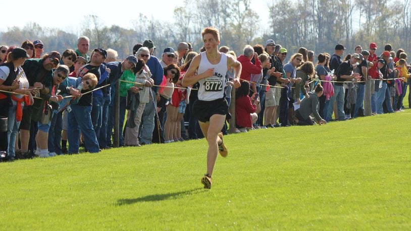Max Pettit of Greenon ran alone most of the way as he lowered his previous best time of 16:16 by eight seconds in claiming a district cross-country title Saturday. GREG BILLING / CONTRIBUTED