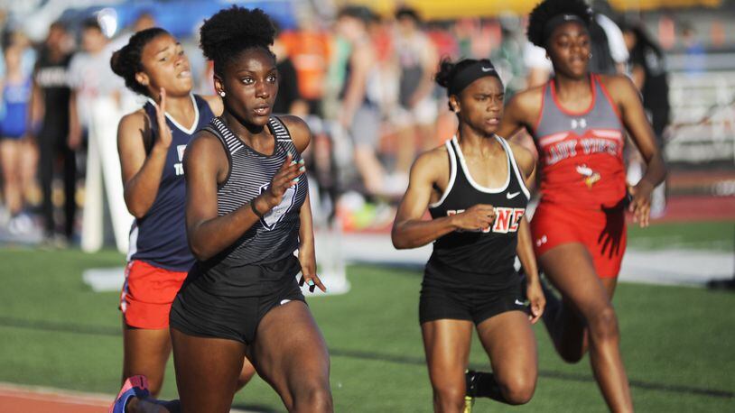 Lakota East sophomore Serena Clark (near left) bested a 100 meters record that had stood since 1990 with an 11.79 in qualifying during the first day of the D-I regional track and field meet at Wayne High School in Huber Heights on Wed., May 23, 2018. MARC PENDLETON / STAFF