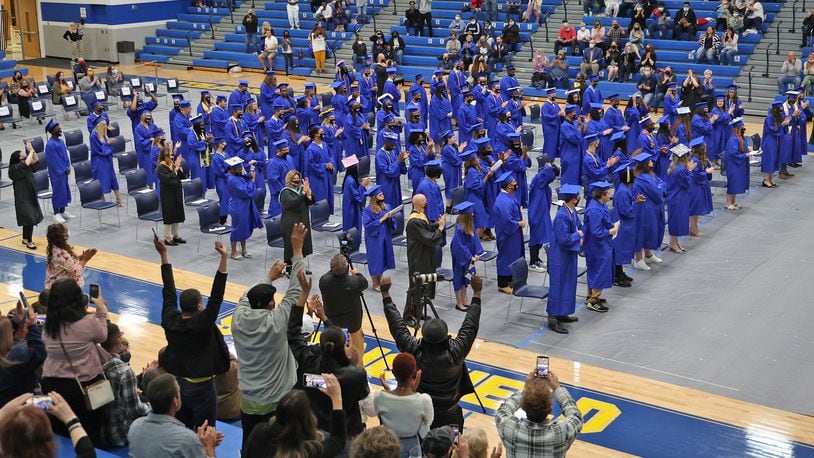 Family and friends cheer as the Springfield High School class of 2021 is presented at the conclusion of the first of three graduation ceremonies Saturday. BILL LACKEY/STAFF