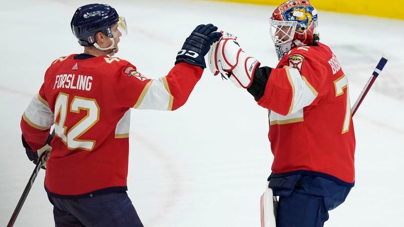 Florida Panthers defenseman Gustav Forsling (42) greets goaltender Sergei Bobrovsky after the Panthers defeated the Boston Bruins in Game 2 of a second-round series of the NHL hockey Stanley Cup playoffs Wednesday, May 8, 2024, in Sunrise, Fla. (AP Photo/Lynne Sladky)