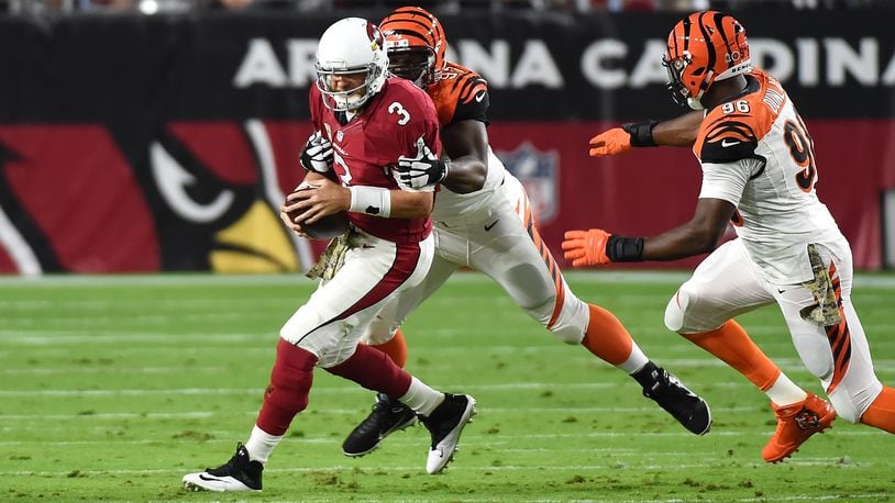 Bengals defensive tackle Geno Atkins gets ready to lay the hammer to former teammate Carson Palmer of the Cardinals in a 2015 game in Arizona.