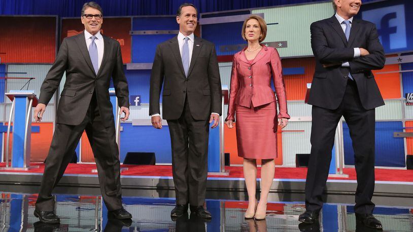 CLEVELAND, OH - AUGUST 06: Republican presidential candidates (L-R) Rick Perry, Rick Santorum, Carly Fiorina and George Pataki take the stage for a presidential pre-debate forum hosted by FOX News and Facebook at the Quicken Loans Arena August 6, 2015 in Cleveland, Ohio. Seven GOP candidates were selected to participate in the forum based on their rank in an average of the five most recent national political polls. (Photo by Chip Somodevilla/Getty Images)