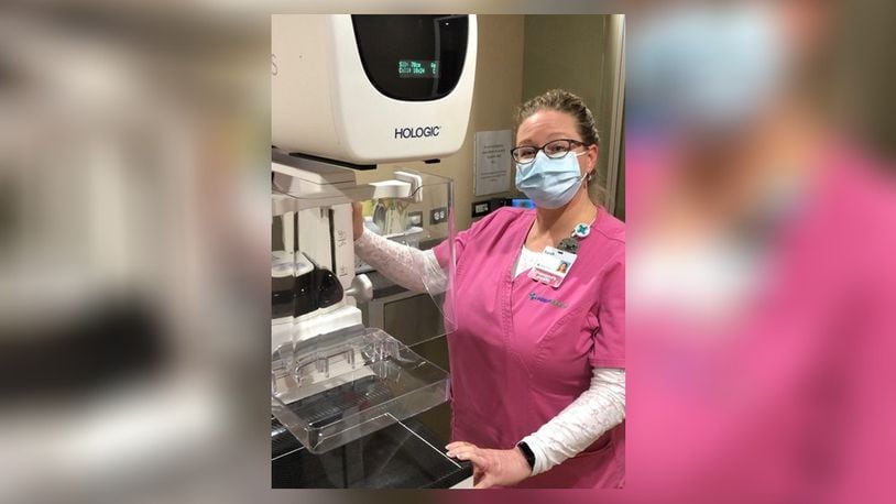 Sarah Conley, Mercy Radiologic Technologist, readies the imaging equipment on the mobile mammography coach for breast health screenings. Contributed