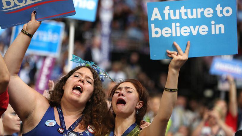 PHILADELPHIA, PA - JULY 25: Supporters of Sen. Bernie Sanders (I-VT) stand and cheer as he delivers remarks on the first day of the Democratic National Convention at the Wells Fargo Center, July 25, 2016 in Philadelphia, Pennsylvania. An estimated 50,000 people are expected in Philadelphia, including hundreds of protesters and members of the media. The four-day Democratic National Convention kicked off July 25. (Photo by Joe Raedle/Getty Images)