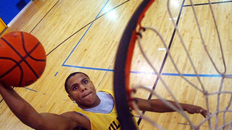 December 9, 2004 News-Sun/Teesha McClam SLUG:snsNateMillerA120904tm.JPG South’s Nate Miller goes for slam dunk during practice at South High School.