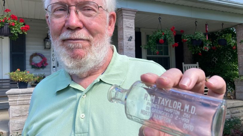 John Bartley prizes a bottle he acquired from Springfield water dealer M. Spangler. Contributed