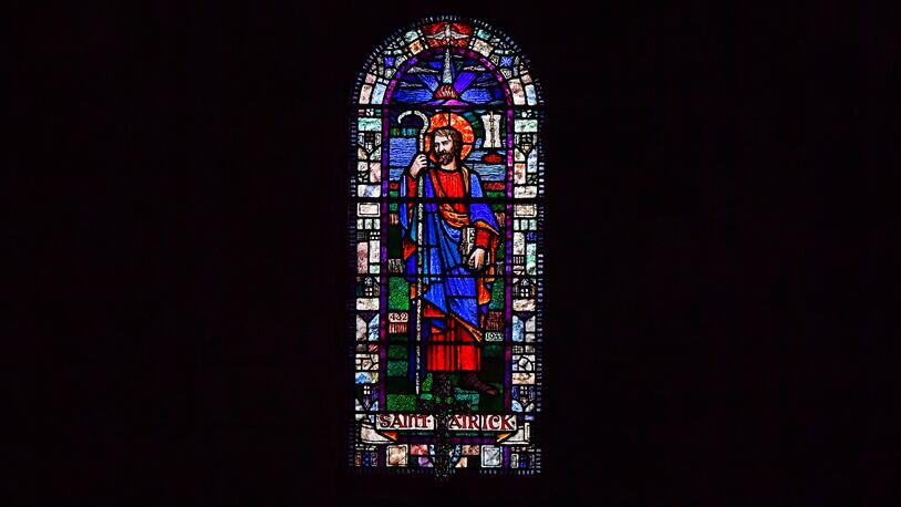 DOWNPATRICK, NORTHERN IRELAND - MARCH 17: A stained glass image of Saint Patrick can be seen as the service and pilgrimage to celebrate Saint Patrick takes place at Saul Church on March 17, 2017 in Downpatrick, Northern Ireland. Saul church is known as the Cradle of Christianity in Ireland and was originally built in 1788 to mark the 1500th anniversary of Patrick landing at nearby Slaney river in 432 AD. The patron saint of Ireland's remains are believed to be buried at Down Cathedral where the pilgrimage ends. (Photo by Charles McQuillan/Getty Images)