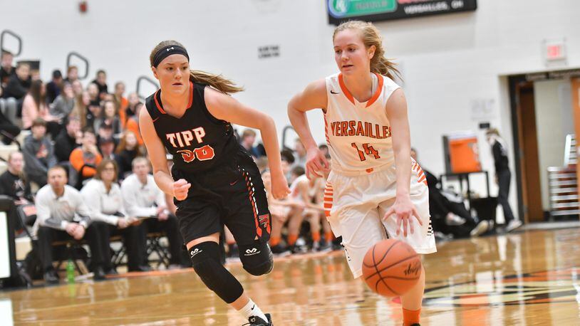 Versailles sophomore Caitlin McEldowney brings the ball up court as Tipp senior Allison Mader applies pressure. Greg Billing/CONTRIBUTED