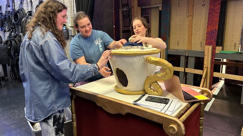Springfield High School students oversee Chip's teacup, one of the props that will be featured in the Wildcat Theatre production of “Disney Beauty and the Beast, the Broadway Musical” at the John Legend Theater, Thursday through Saturday. Springfield City School District students will also be treated to a special performance and see the props and costumes this week.