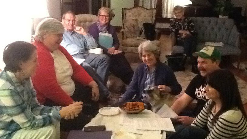 Members of the Springfield Civic Theatre, (from left) Rita Brooks, Suzanne Grote, Randy McFarland, Kay Richards of the Woman’s Town Club, and (on the floor, center) Mary Beth McFarland, Josh Compston and Jen Compston (right, foreground) work on plans for the upcoming Murder at Buchwalter High 50th Reunion fundraiser. CONTRIBUTED